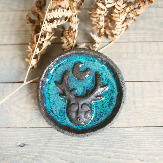 Handmade ceramic incense holder featuring mystic creature and the moon design. Crafted from black grogged clay and covered with blue glaze.