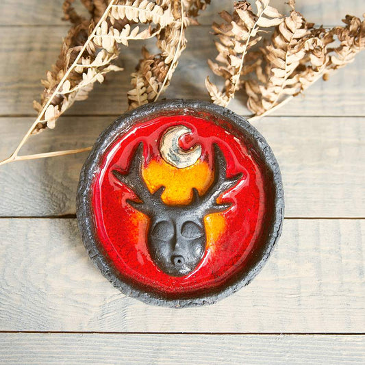 Handmade ceramic incense holder featuring mystic creature and gold plated moon design. Crafted from black grogged clay and covered with red glaze.