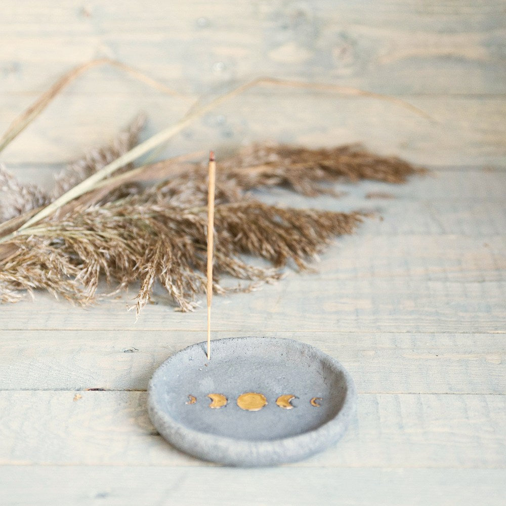 Handmade ceramic incense holder featuring gold plated moon design. Crafted from grey grogged clay.
