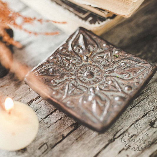 Handmade ceramic square soap dish. Crafted from white clay and finished with a matt brown glaze. Designed with drainage holes, a concave shape, and four little feet.