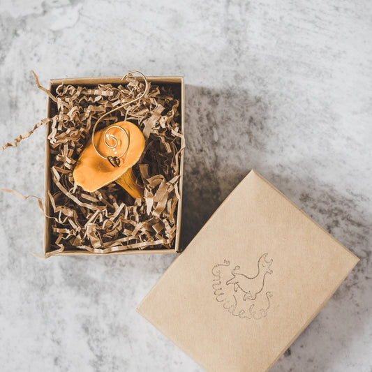 Chanterelle ceramic mushroom ornament with hook packed in a paper gift box.
