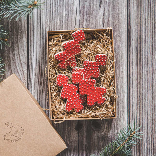 Ceramic red dotted spruce Christmas tree decorations with hooks.