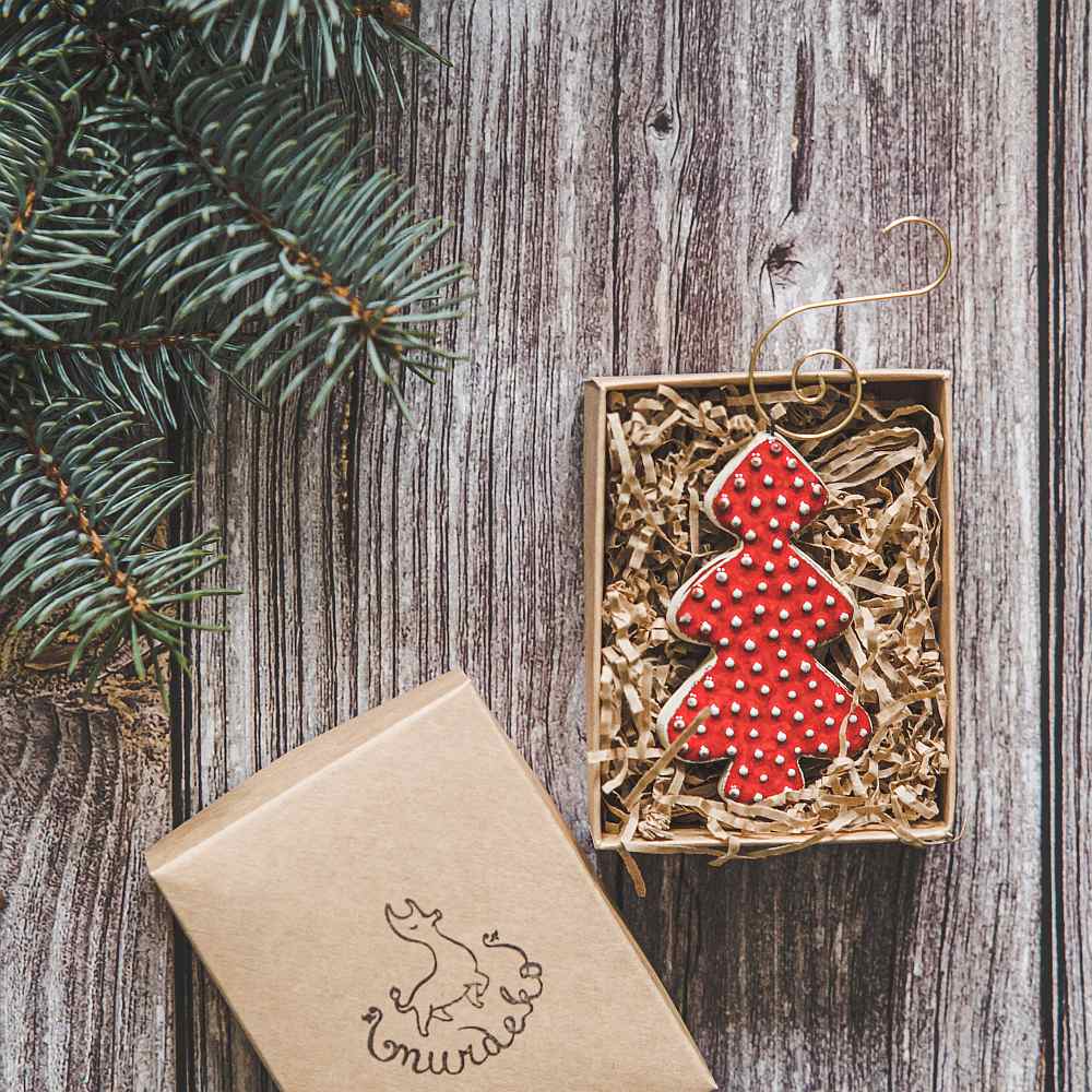 Ceramic red dotted fir Christmas tree ornament with hook.