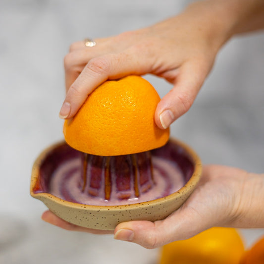 red ceramic lemon squeezer