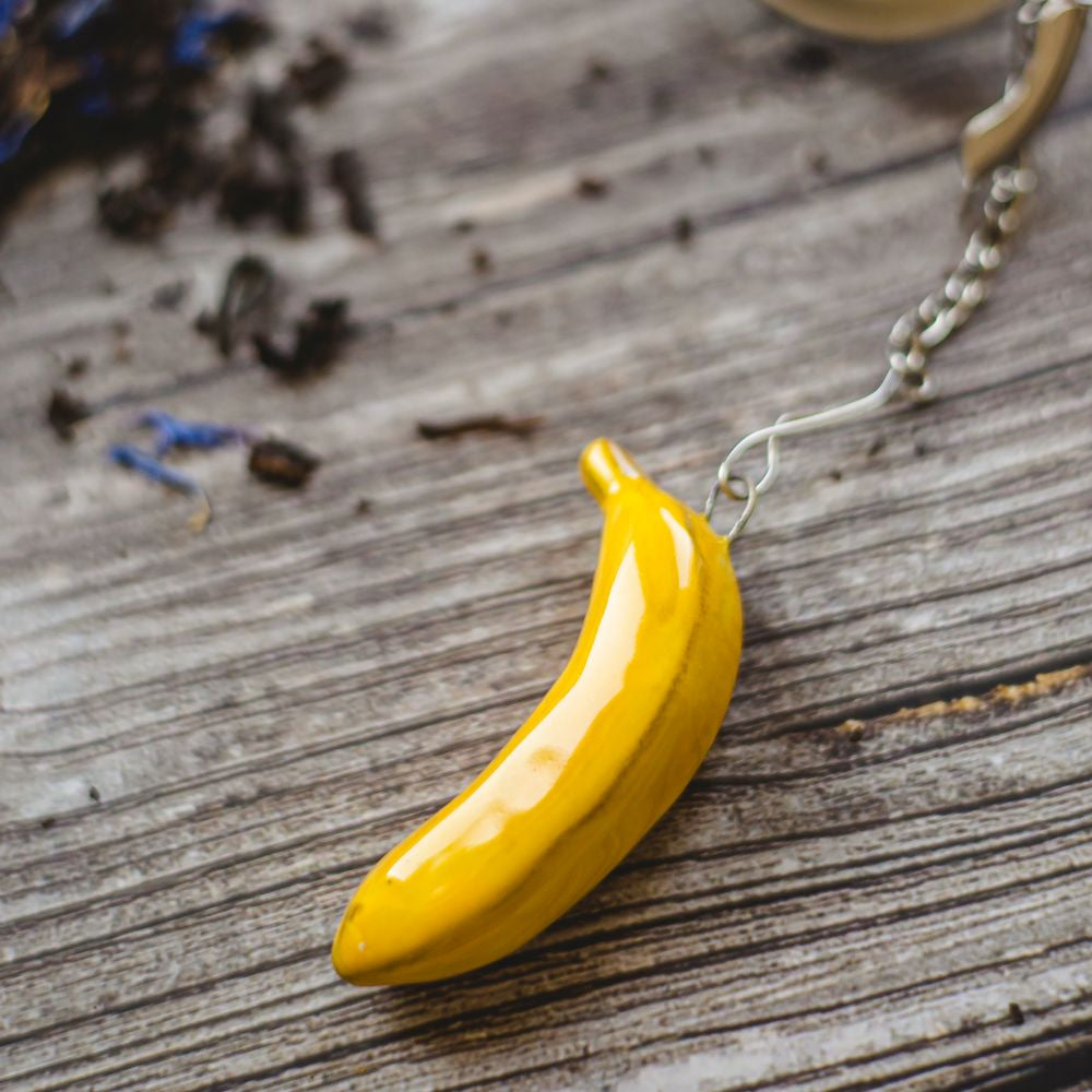 tea infuser with ceramic banana hanging from the chain
