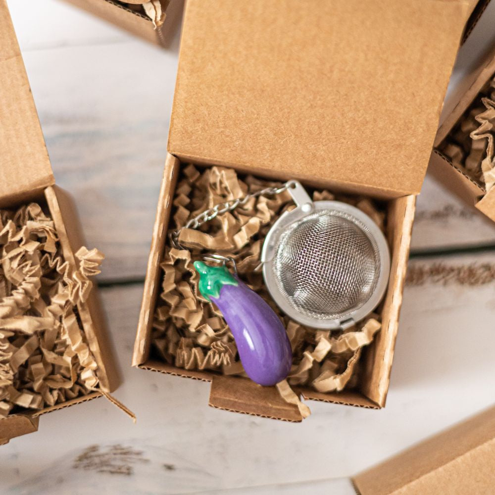 tea infuser with ceramic blue eggplant hanging from the chain