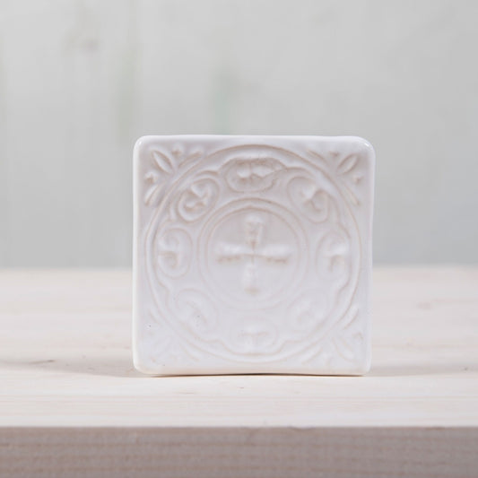 Handmade ceramic square soap dish. Crafted from white clay and finished with a glossy white glaze. Designed with drainage holes, a concave shape, and four little feet.