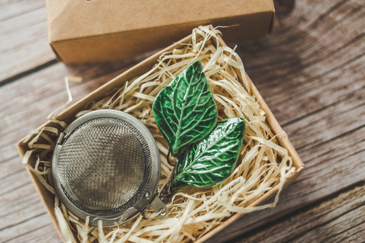 Tea infuser with green leaves