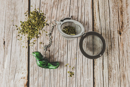 Tea infuser with green bird