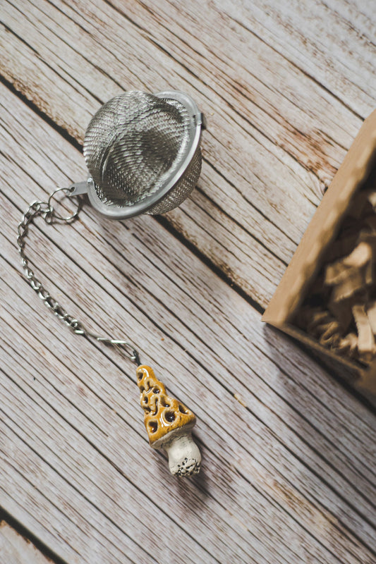 Tea infuser with gyromitra mushroom