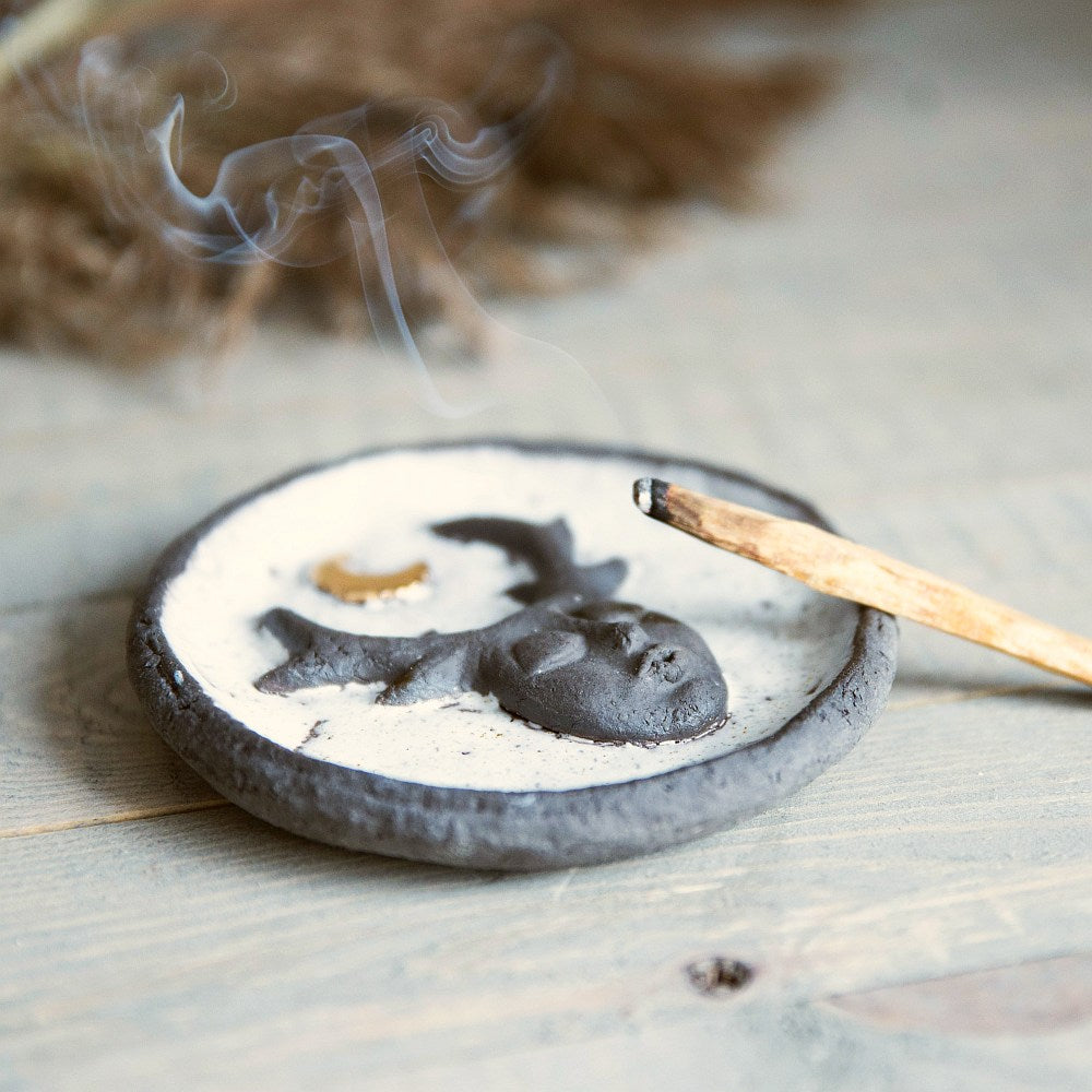 Handmade ceramic incense holder featuring mystic creature and gold plated moon design. Crafted from black grogged clay and covered with white glaze.