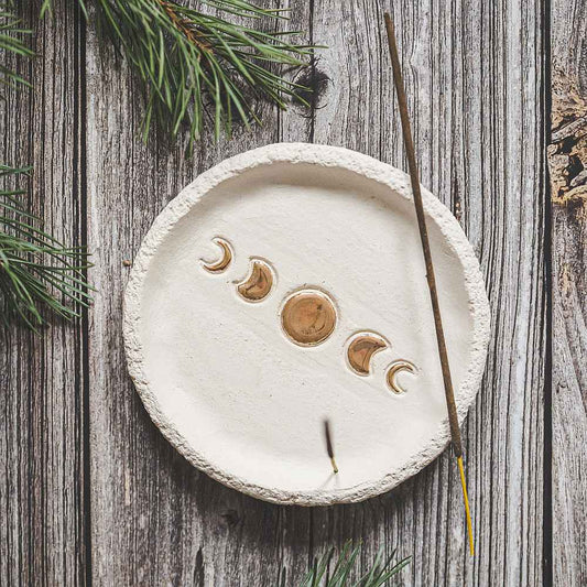 Handmade ceramic incense holder featuring gold plated moon phases design. Crafted from ivory grogged clay.