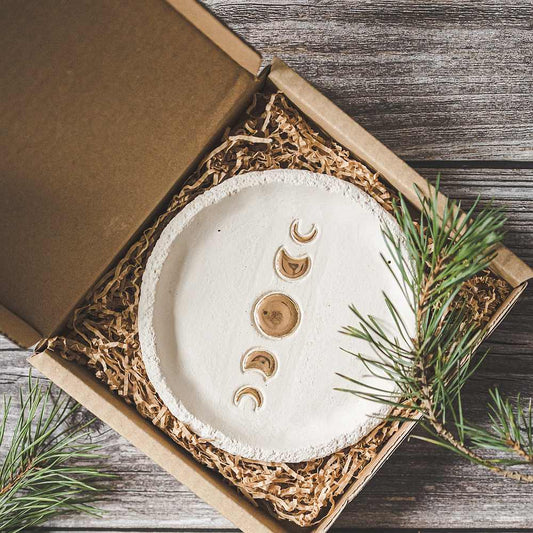 Handmade ceramic incense holder featuring gold plated moon phases design. Crafted from ivory grogged clay.