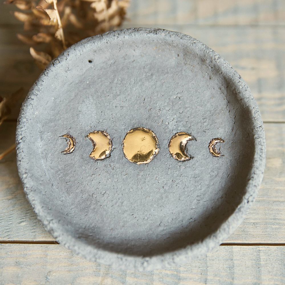 Handmade ceramic incense holder featuring gold plated moon design. Crafted from grey grogged clay.