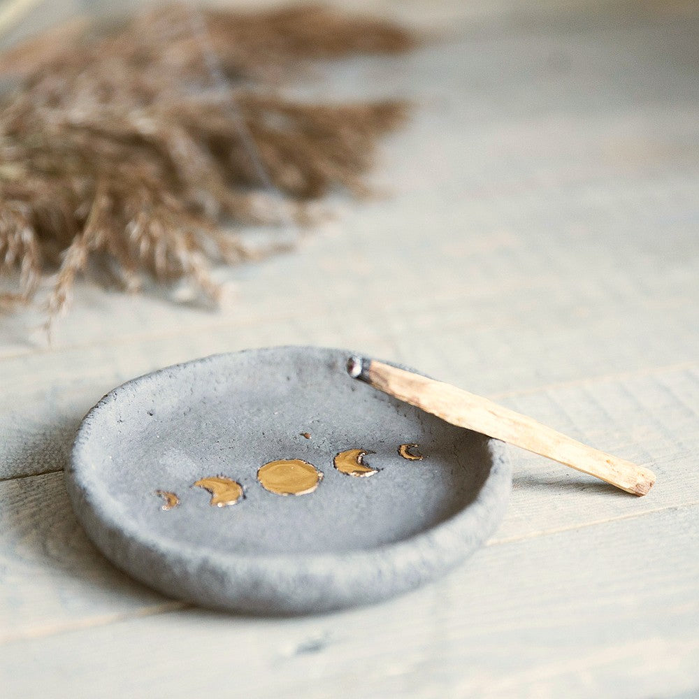 Handmade ceramic incense holder featuring gold plated moon design. Crafted from grey grogged clay.