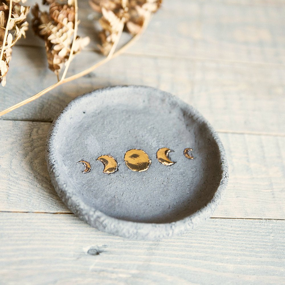 Handmade ceramic incense holder featuring gold plated moon design. Crafted from grey grogged clay.