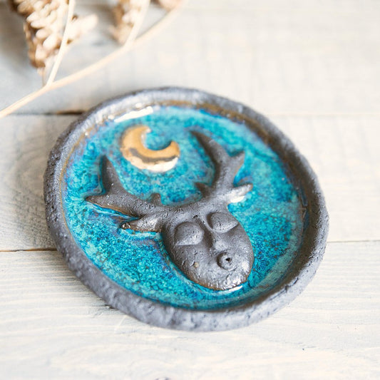 Handmade ceramic incense holder featuring mystic creature and gold plated moon design. Crafted from black grogged clay and covered with blue glaze.