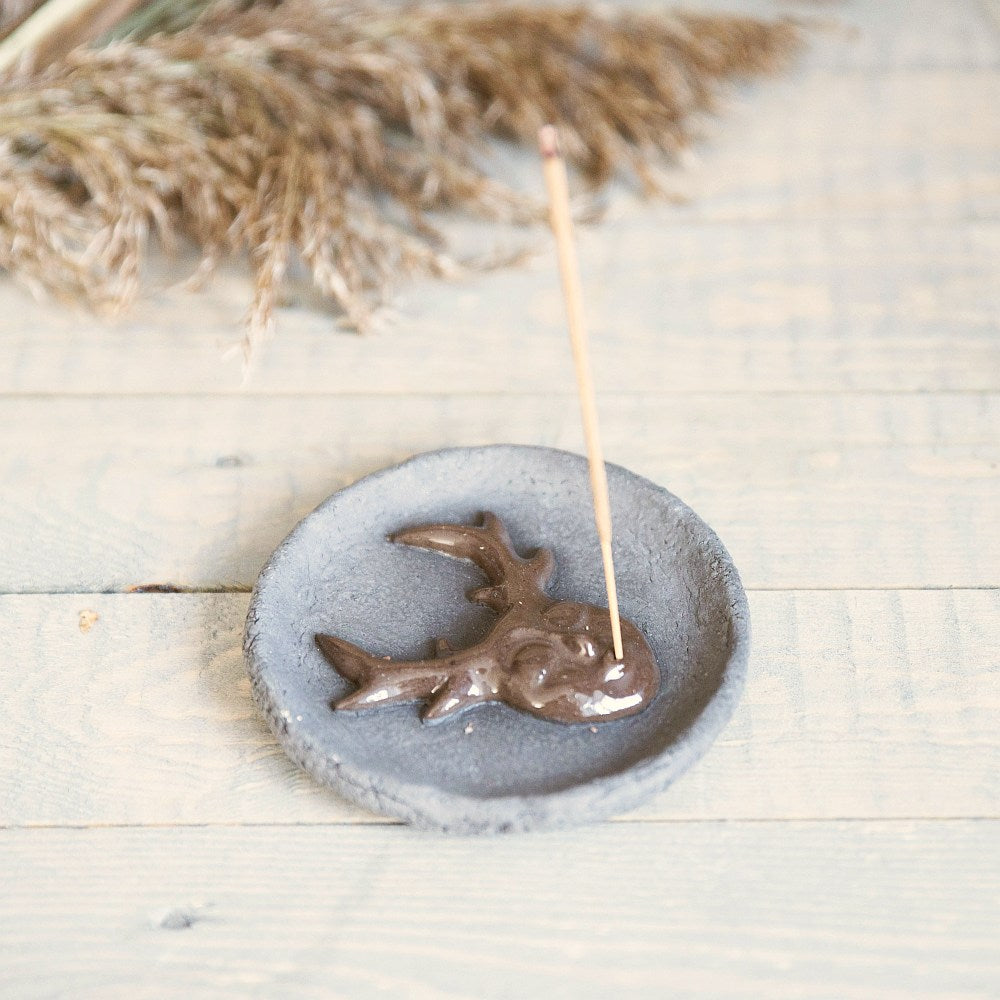 Handmade ceramic incense holder featuring mystic creature. Crafted from black grogged clay.