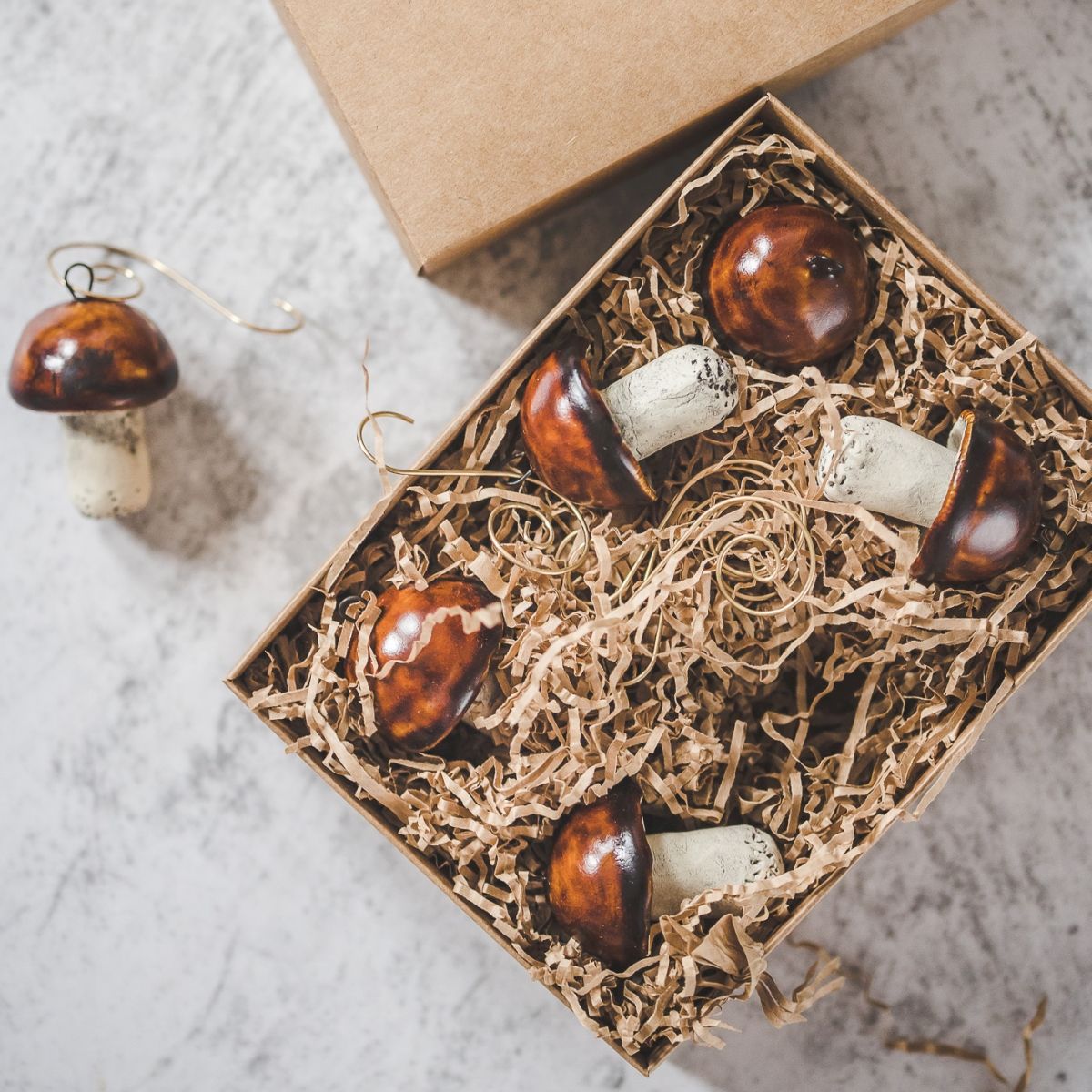 Christmas ornament set of six boletus mushrooms. Packed with hooks in a paper gift box.