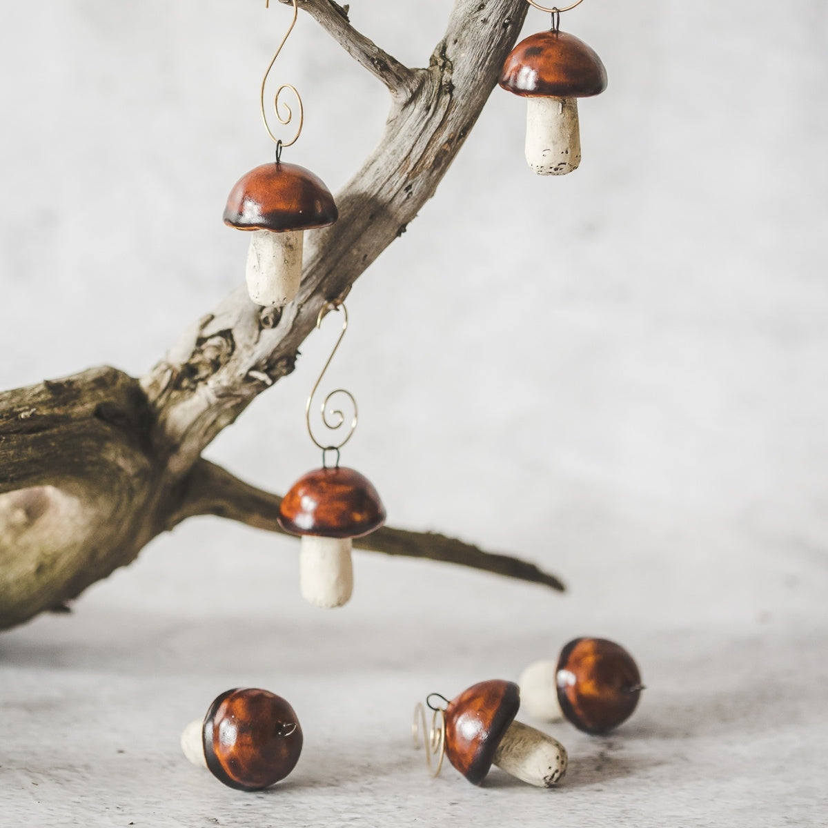 Christmas ornament set of six boletus mushrooms. Hanging on a Christmas tree.