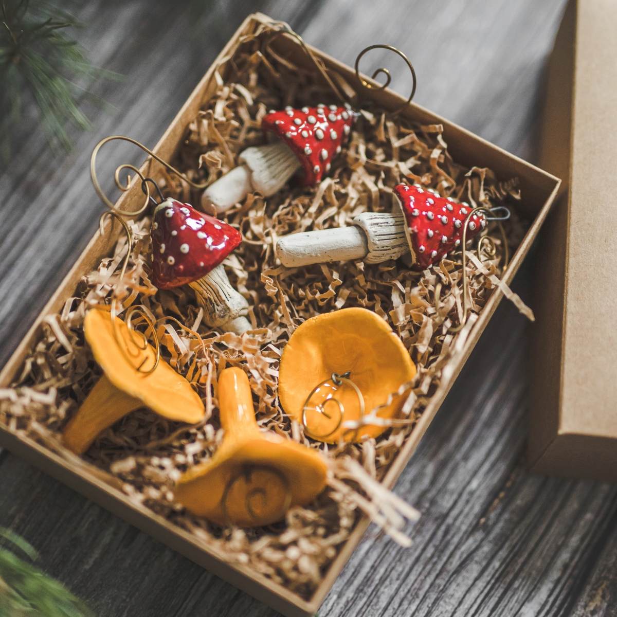 Christmas ornament set of six red amanita and orange chanterelle mushrooms. Packed in a gift box with hooks.