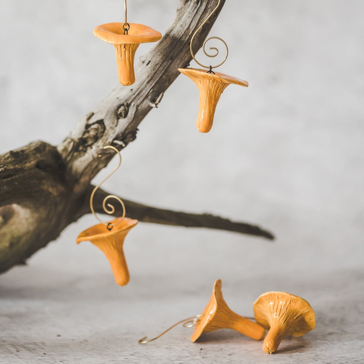 Christmas ornaments ceramic chanterelle mushrooms. Hanging on a Christmas tree.