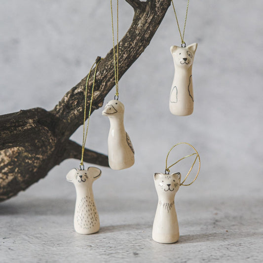 Christmas tree domestic animals decoration set of four. Dog, cat, mouse and duck ceramic ornaments hanging from a gold string.