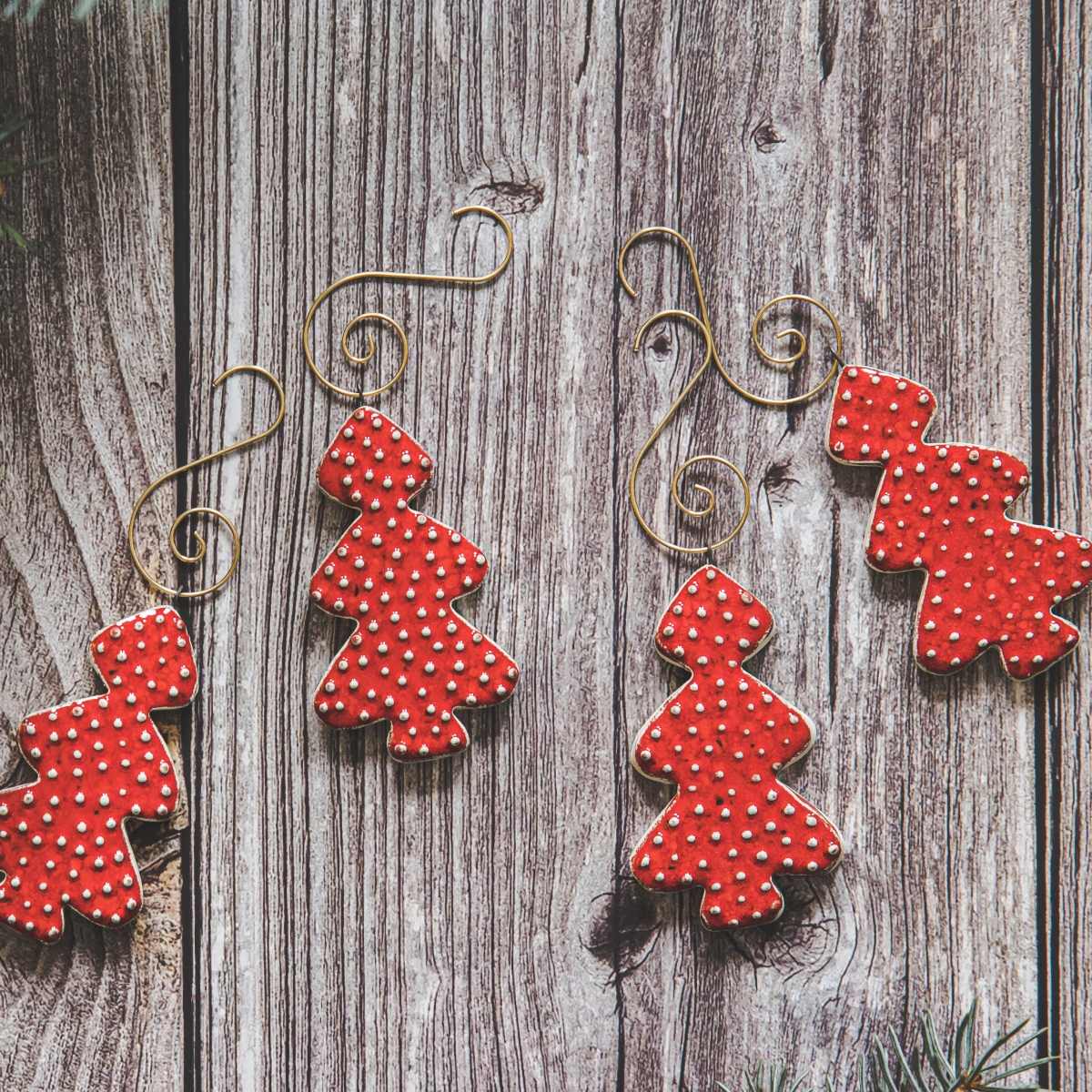 Ceramic red dotted spruce Christmas tree decorations with hooks.