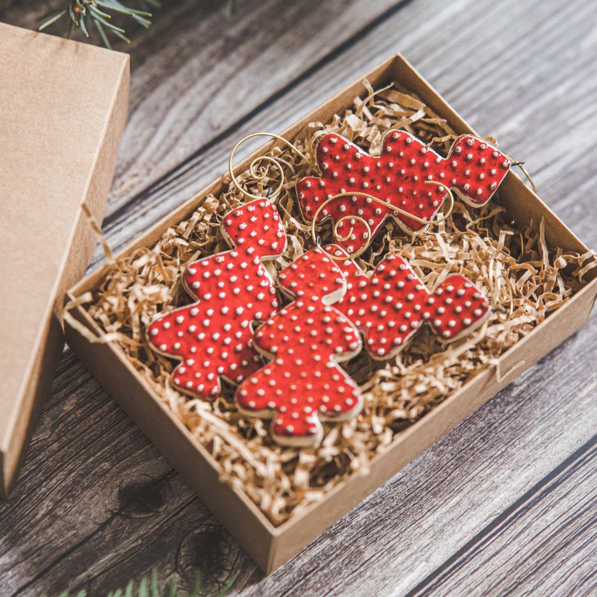 Ceramic red dotted spruce Christmas tree decorations with hooks.