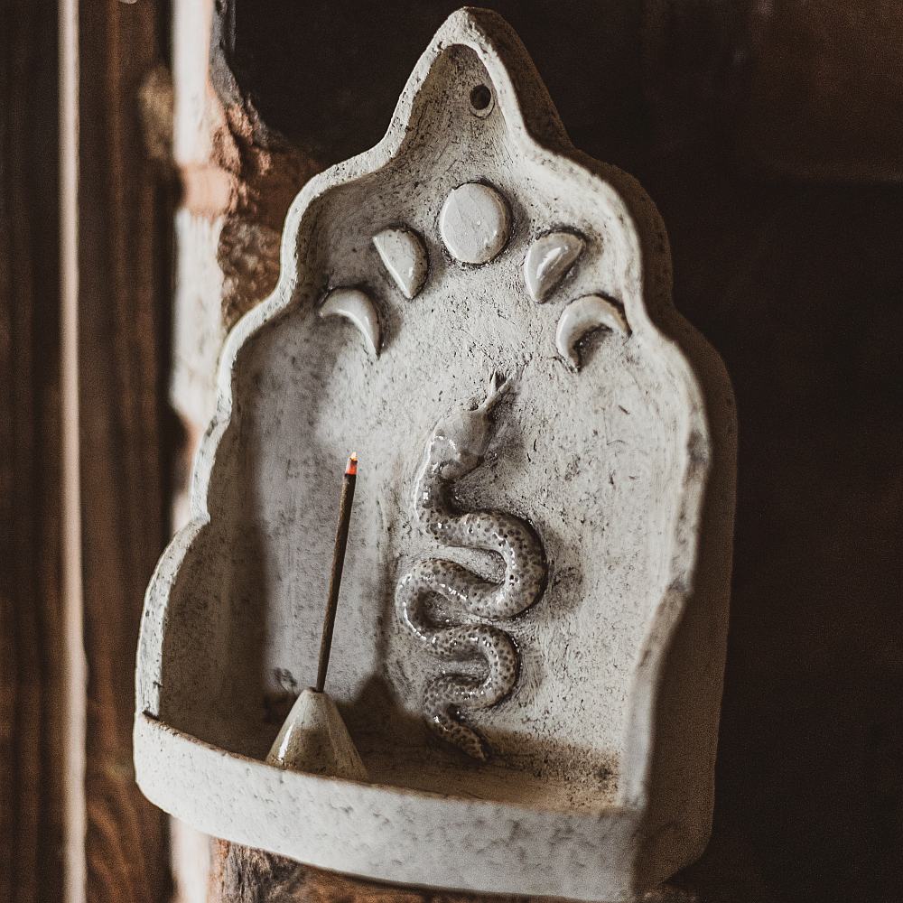 Hanging ceramic incense holder with a snake