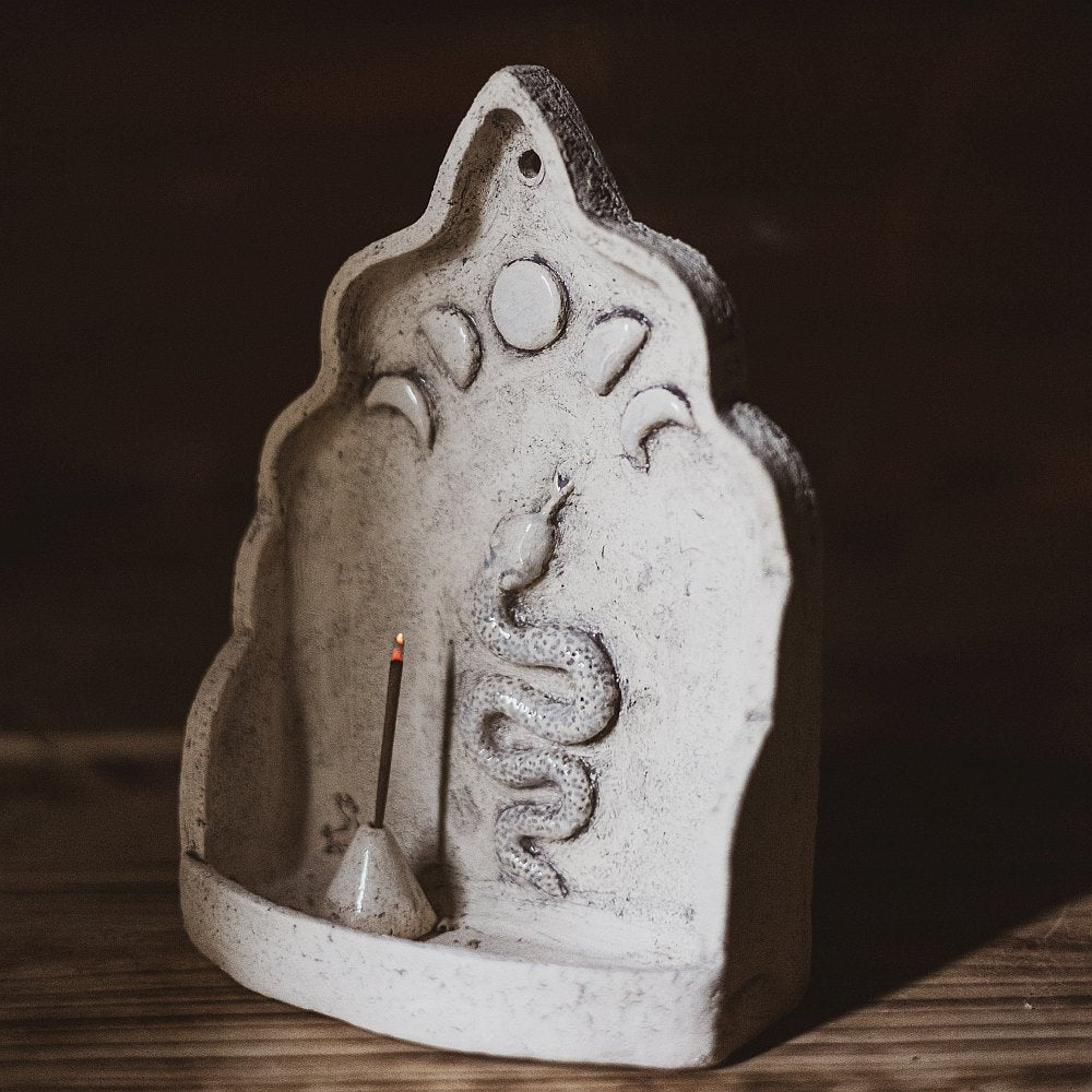 Hanging ceramic incense holder with a snake