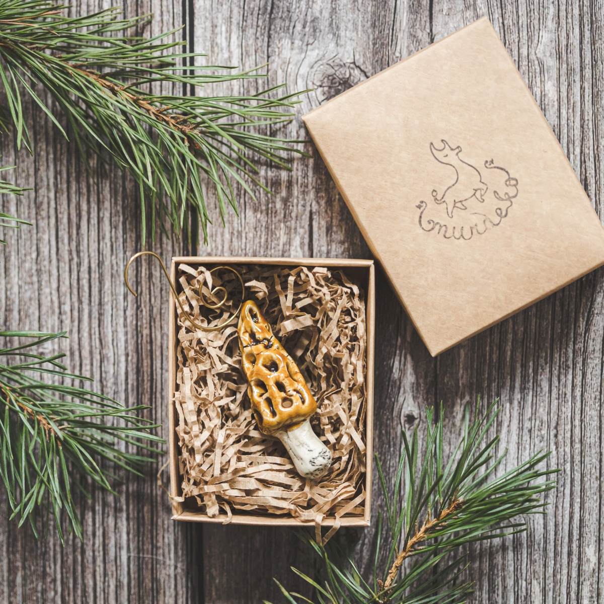 Ceramic False Morel mushroom with glossy brown cap and cream-colored stem. Handmade Christmas tree ornament with hook.