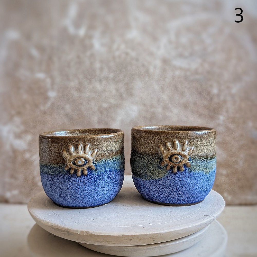 Puodelis su įlinkimu