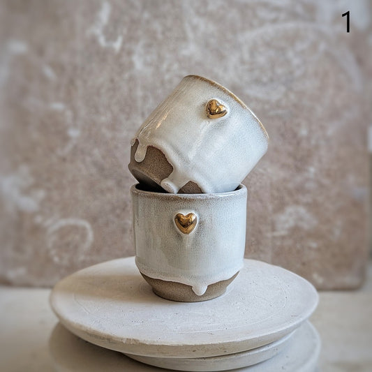 Puodelis su įlinkimu