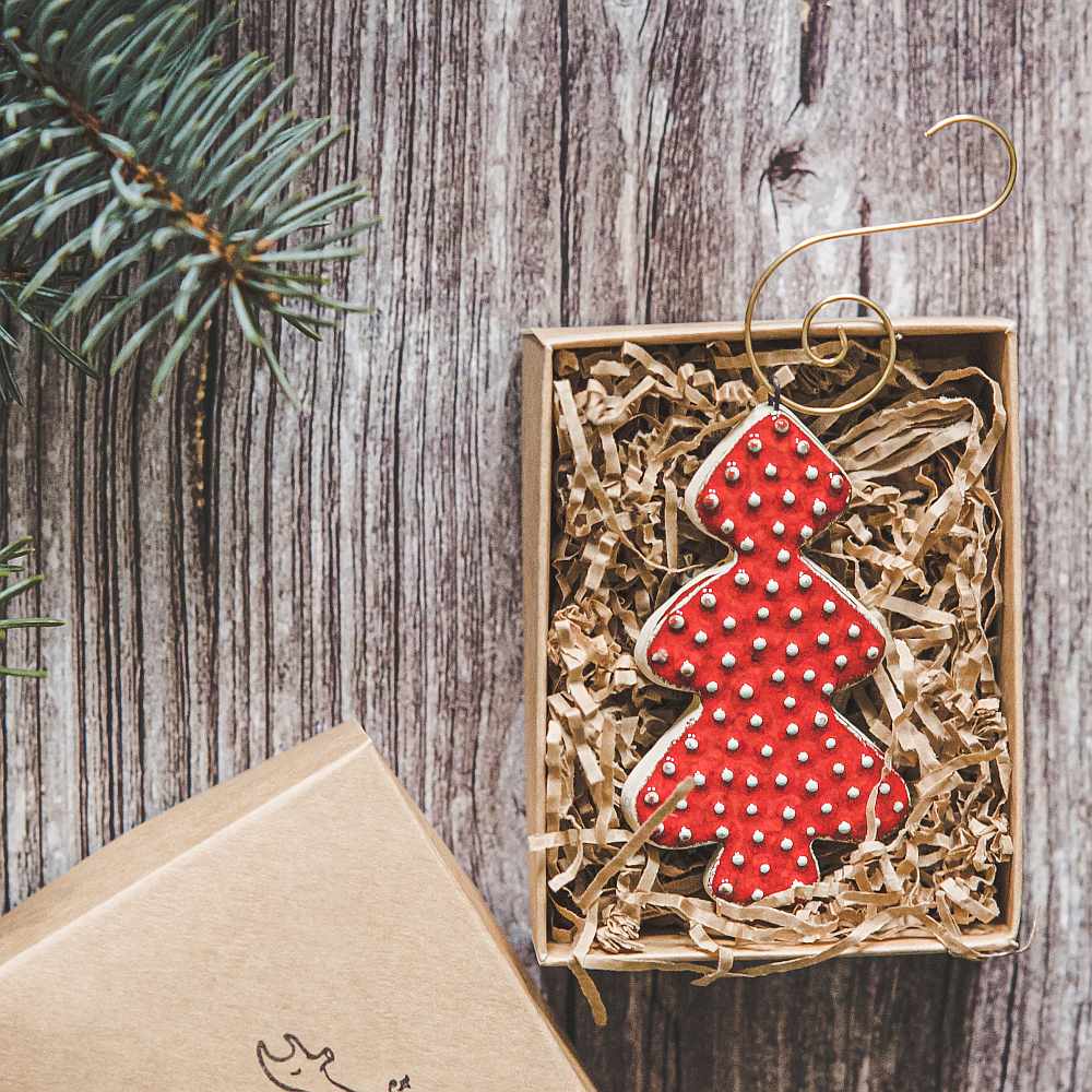 Ceramic red dotted fir Christmas tree ornament with hook.
