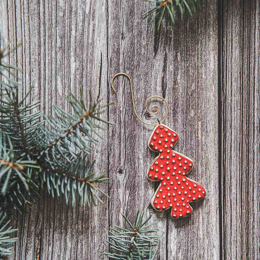 Ceramic red dotted fir Christmas tree ornament with hook.