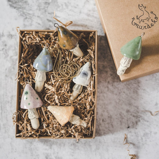 Christmas ornament set of six pastel blue, purple, brown, yellow, white and green mushrooms. Packed in a gift box with hooks.