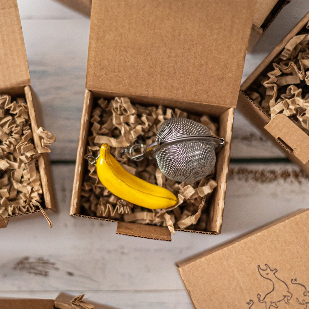 tea infuser with ceramic banana hanging from the chain