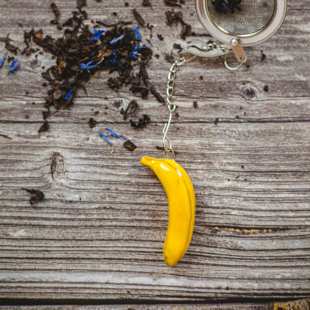 tea infuser with ceramic banana hanging from the chain