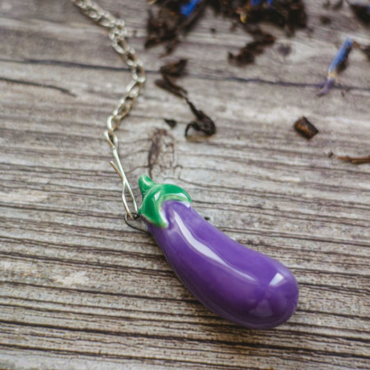tea infuser with ceramic blue eggplant hanging from the chain