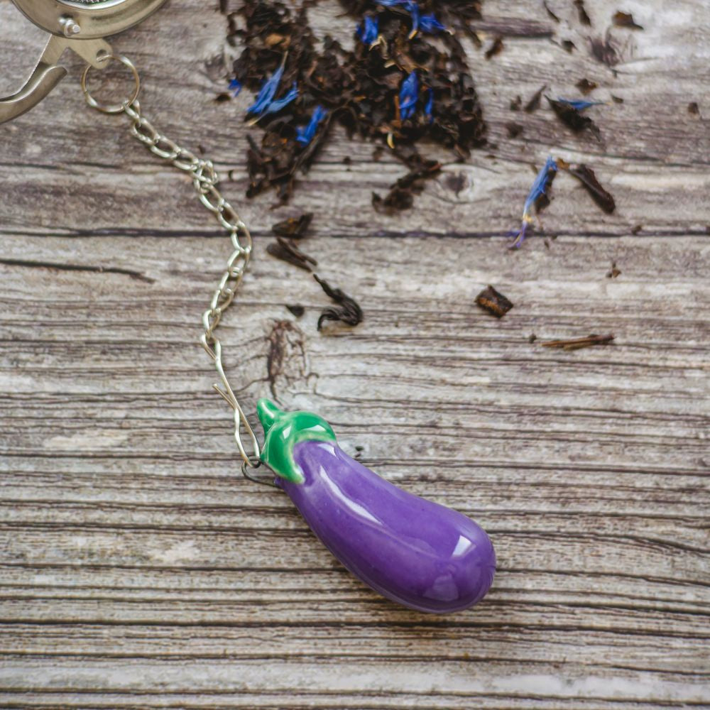 tea infuser with ceramic blue eggplant hanging from the chain