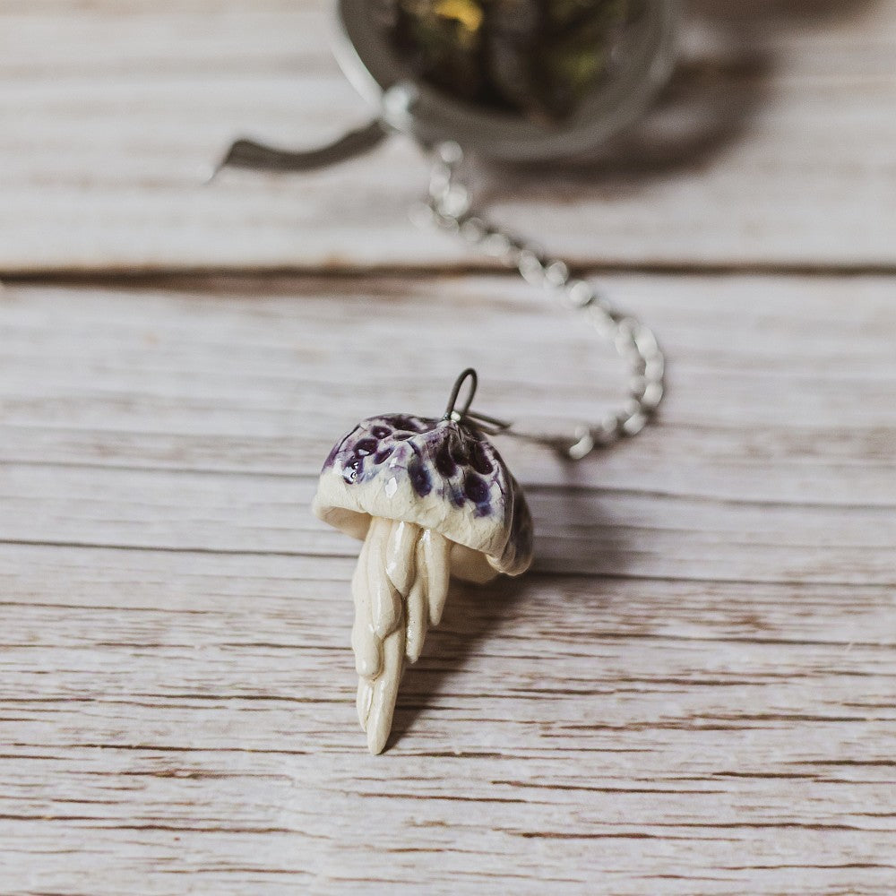 tea infuser with ceramic purple jellyfish hanging from the chain