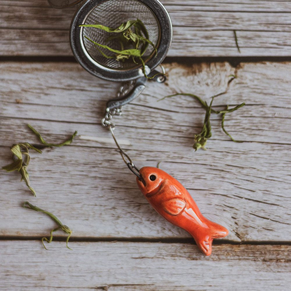 tea infuser with ceramic red fish hanging from the chain