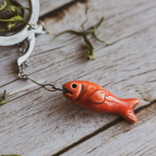 tea infuser with ceramic red fish hanging from the chain