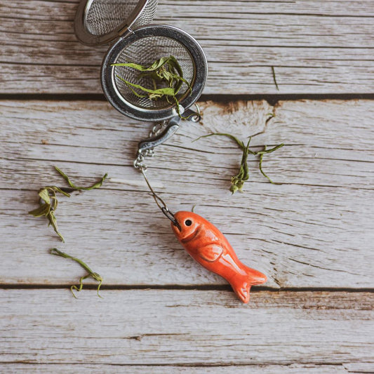tea infuser with ceramic red fish hanging from the chain