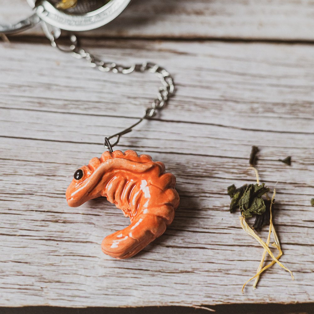 tea infuser with ceramic red shrimp hanging from the chain