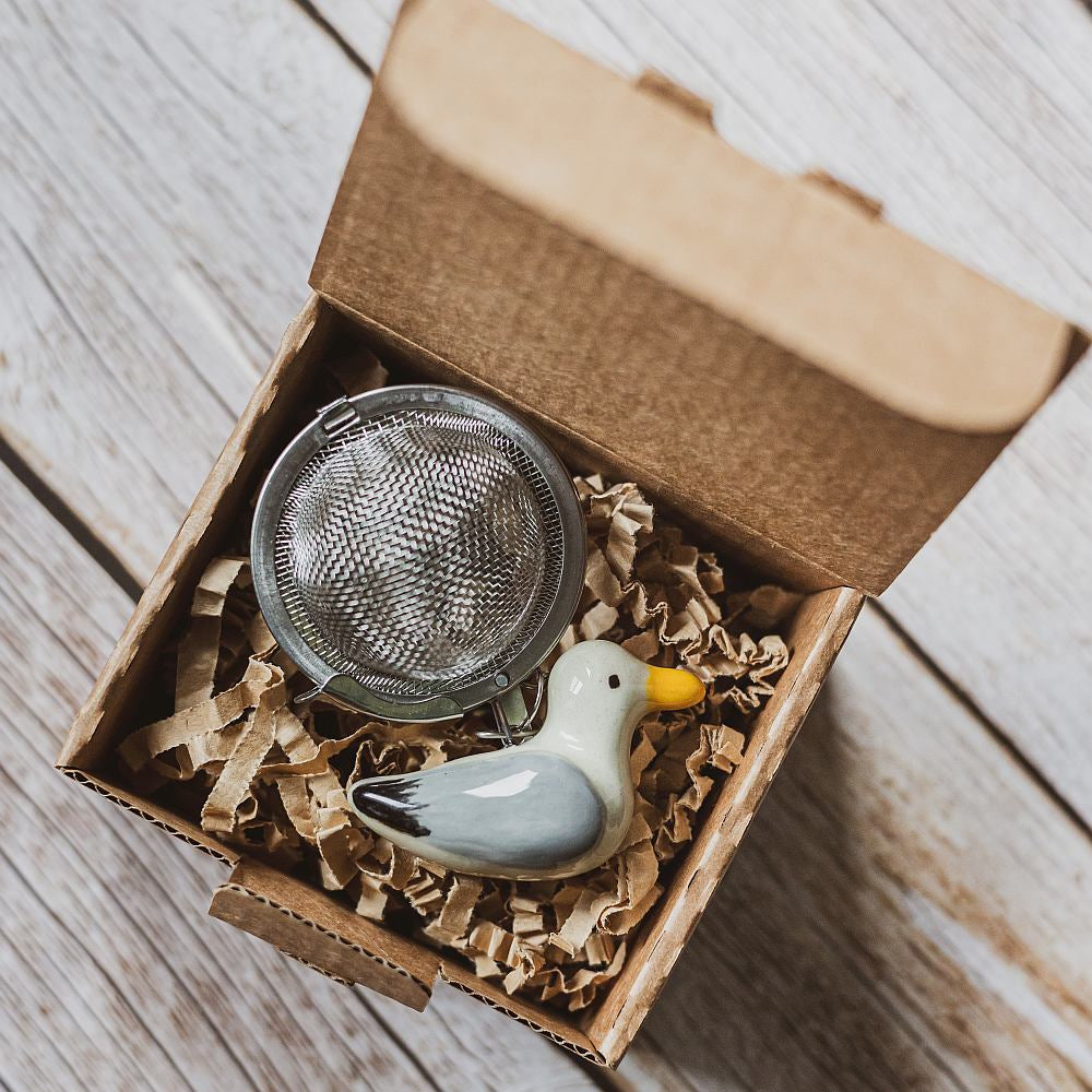 tea infuser with ceramic seagull hanging from the chain