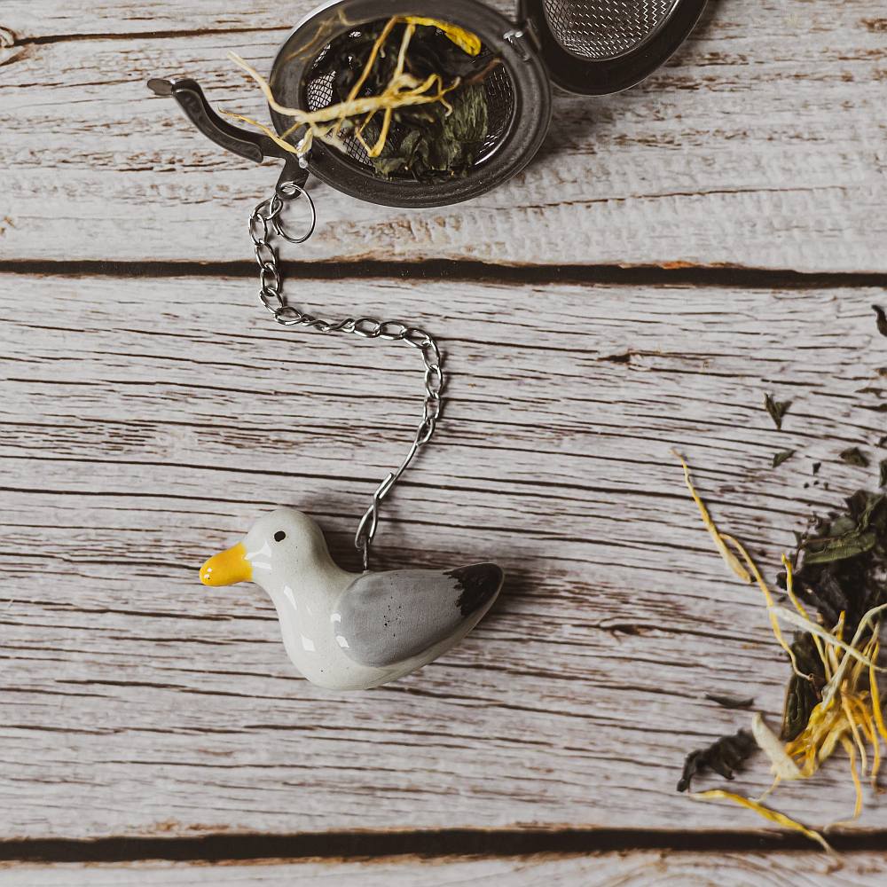 tea infuser with ceramic seagull hanging from the chain