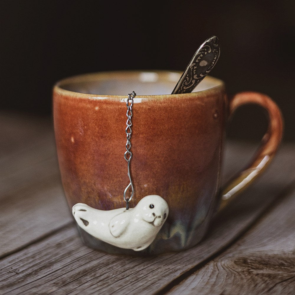tea infuser with ceramic seal hanging from the chain